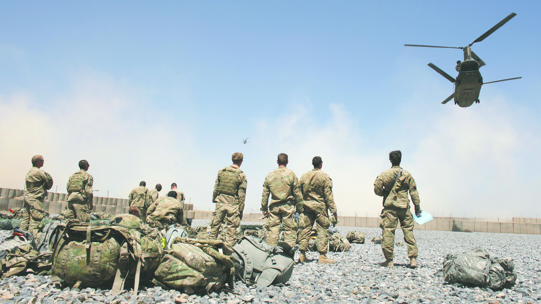 Helicopters carrying U.S. Army soldiers from the 1-320 Field Artillery Regiment, 101st Airborne Division, take off from Combat Outpost Terra Nova as the soldiers head home following a 10-month deployment in the Arghandab Valley north of Kandahar April 23, 2011.  REUTERS/Bob Strong  (AFGHANISTAN - Tags: MILITARY POLITICS IMAGES OF THE DAY)