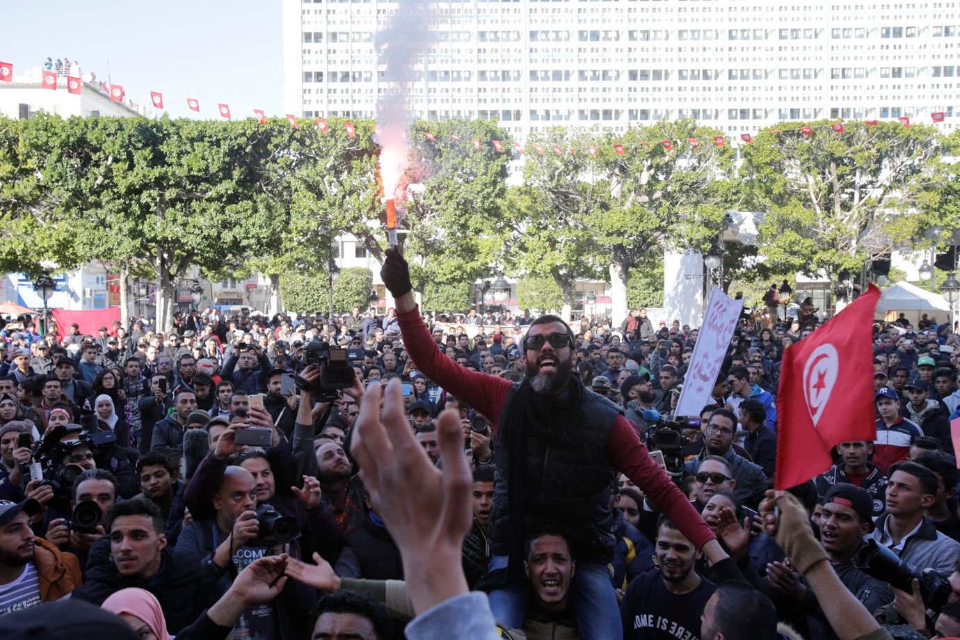 People shout slogans during demonstrations on the seventh anniversary of the toppling of president Zine El-Abidine Ben Ali, in Tunis, Tunisia January 14, 2018. REUTERS/Youssef Boudlal