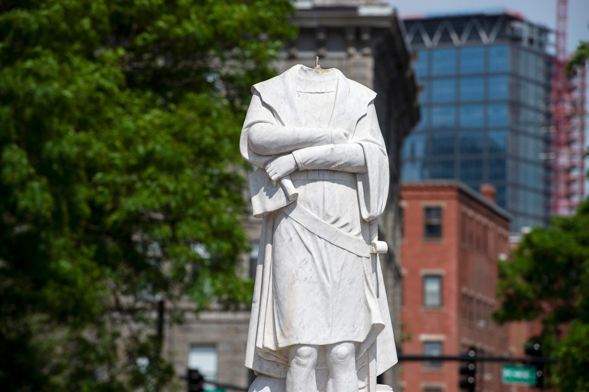 A decapitated statue of Christopher Columbus is viewed at Christopher Columbus Park in Boston Massachusetts on June 10, 2020. - The statue's head, damaged overnight, was recovered by the Boston Police Department, as a movement to remove statues commemorating slavers and colonizers continues to sweep across the US. (Photo by Joseph Prezioso / AFP) (Photo by JOSEPH PREZIOSO/AFP via Getty Images)