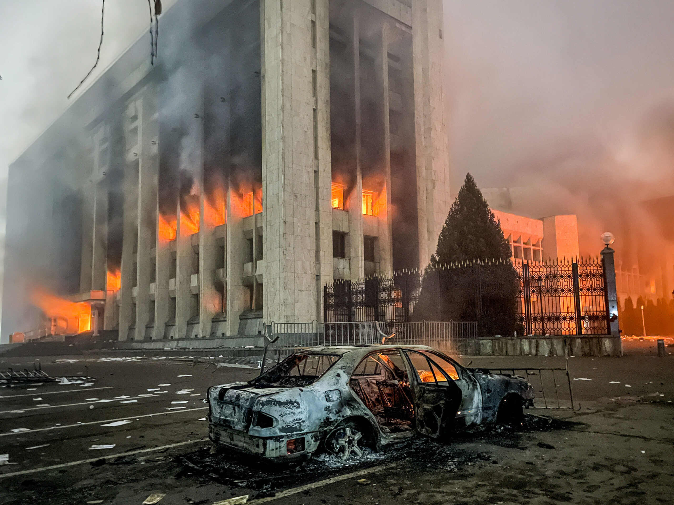 ALMATY, KAZAKHSTAN - JANUARY 5, 2022: A burnt car is seen by the mayors office on fire. Protests are spreading across Kazakhstan over the rising fuel prices; protesters broke into the Almaty mayors office and set it on fire. Valery Sharifulin/TASS (Photo by Valery SharifulinTASS via Getty Images)