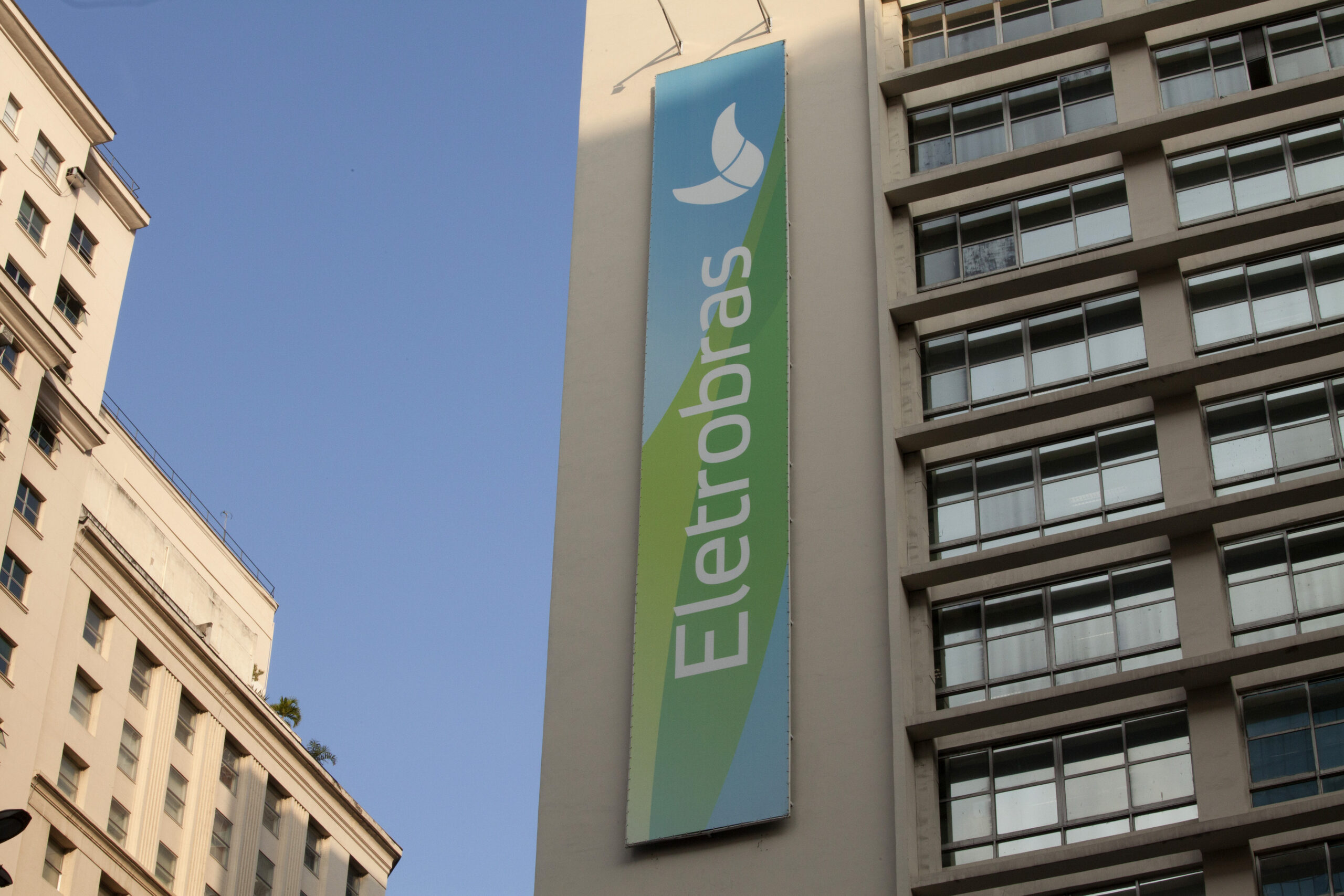 The headquarters building of Centrais Eletricas Brasileiras S.A., the state-owned utility company known as Eletrobras, stands in Rio de Janeiro, Brazil, on Wednesday, July 29, 2015. Eletrobras, which accounts for more than a third of energy generation in Latin Americas biggest economy, was plunged into the eight-month corruption scandal thats roiled Brazils financial markets and government on Tuesday when Federal Police arrested the former head of the utilitys nuclear unit, Eletronuclear. Photographer: Nadia Sussman/Bloomberg