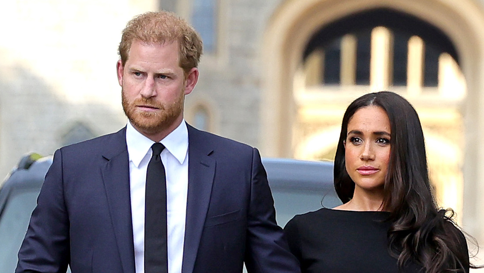 WINDSOR, ENGLAND - SEPTEMBER 10: Prince Harry, Duke of Sussex, and Meghan, Duchess of Sussex on the long Walk at Windsor Castle arrive to view flowers and tributes to HM Queen Elizabeth on September 10, 2022 in Windsor, England. Crowds have gathered and tributes left at the gates of Windsor Castle to Queen Elizabeth II, who died at Balmoral Castle on 8 September, 2022. (Photo by Chris Jackson/Getty Images)