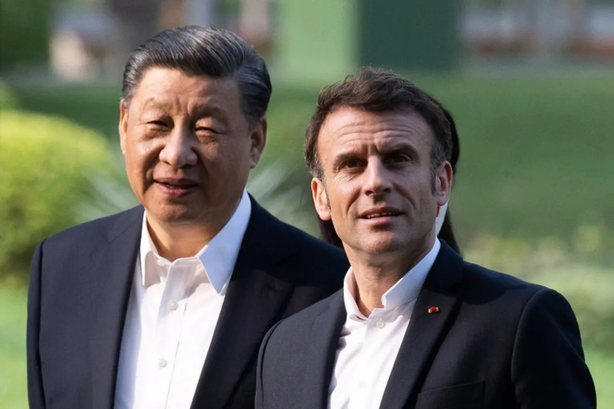 102654936-topshot-chinese-president-xi-jinping-l-and-french-president-emmanuel-macron-r-visit