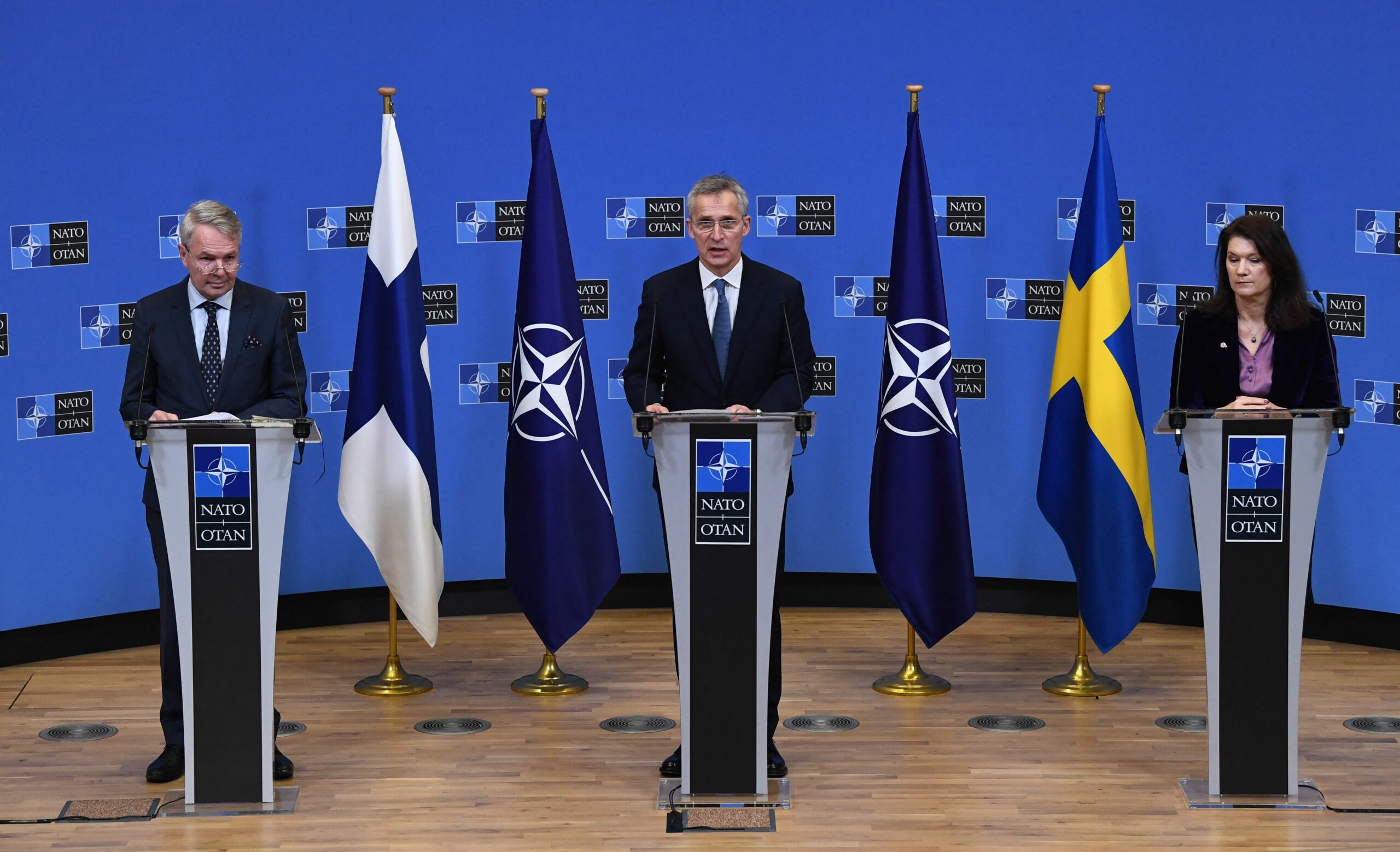 NATO Secretary General Jens Stoltenberg (C), Finland Ministers for Foreign Affairs Pekka Haavisto (L) and Sweden Foreign minister Ann Linde (R) give a press conference after their meeting at the Nato headquarters in Brussels on January 24, 2022. (Photo by JOHN THYS / AFP) (Photo by JOHN THYS/AFP via Getty Images)