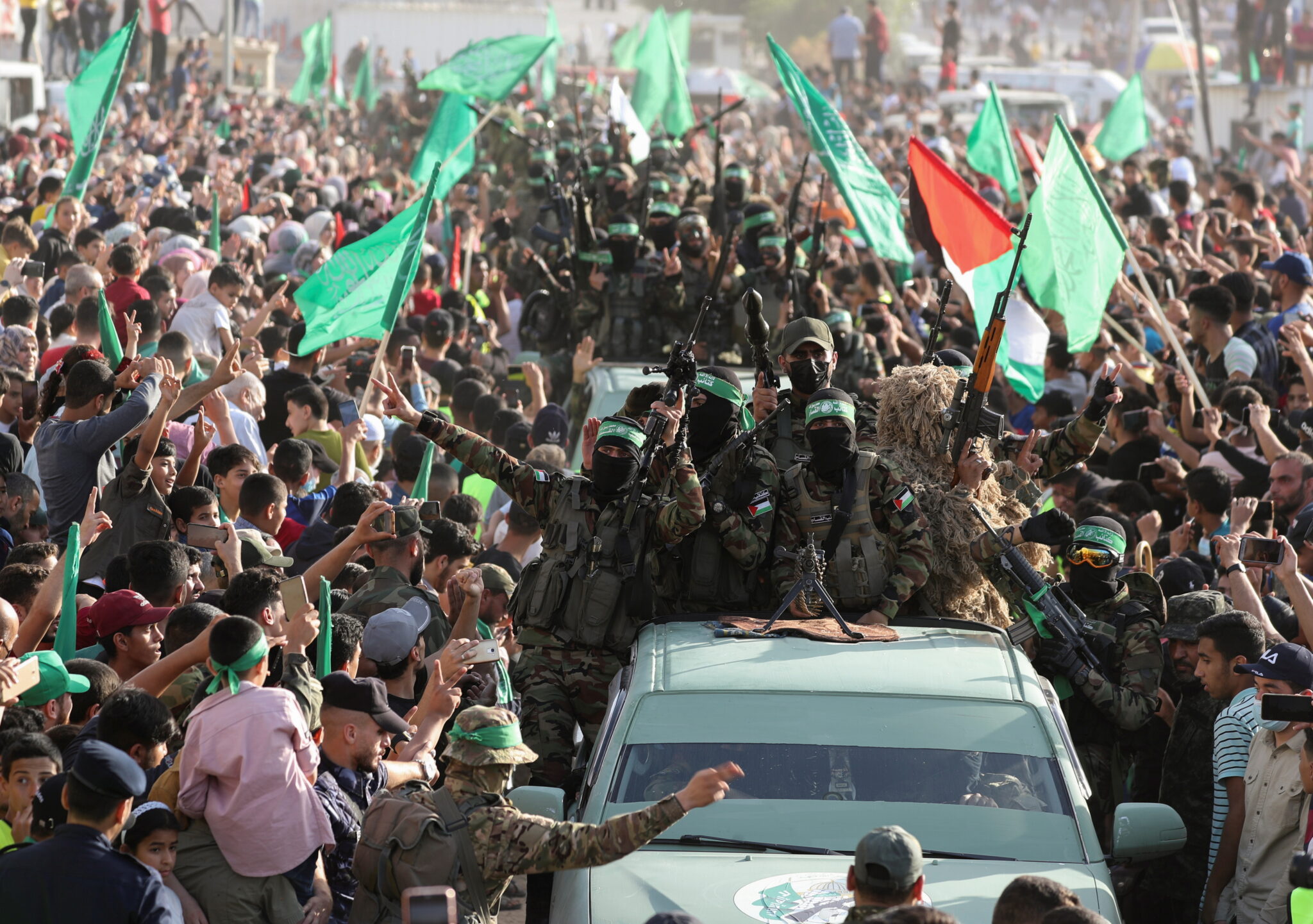 People gather as Palestinian Hamas militants hold an anti-Israel rally in the northern Gaza Strip, May 30, 2021. REUTERS/Mohammed Salem